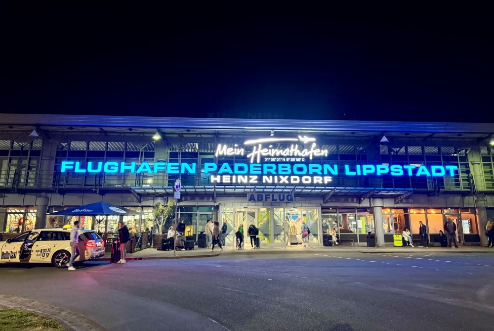 55 years of Paderborn-Lippstadt Airport. View of the airport entrance with the illuminated letters with its new name addition Heinz Nixdorf in gratitude for his support.